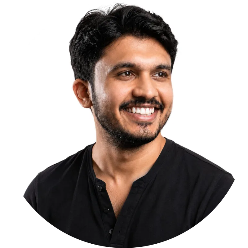 Portrait of Awais Ali, smiling, in a black shirt